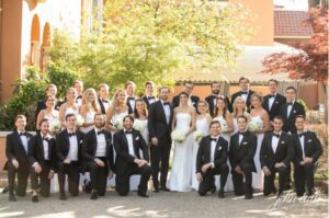 Bridesmaids, groomsmen, bride, and groom