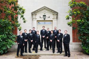 Groomsmen and groom outside the church
