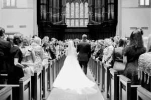 The bride walking down the aisle
